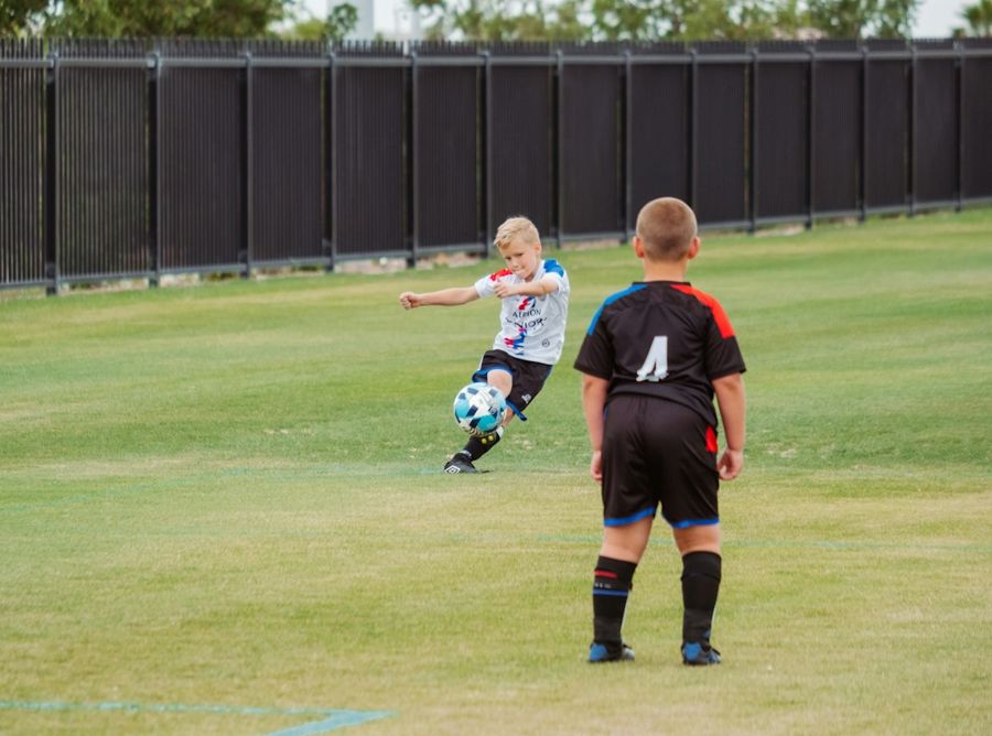 Two boys playing soccer